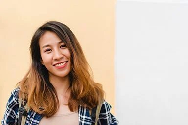 Traveler backpacker asian woman travel in Bangkok, Thailand. Happy young female spending holiday trip at amazing landmark and enjoy her journey in traditional city.